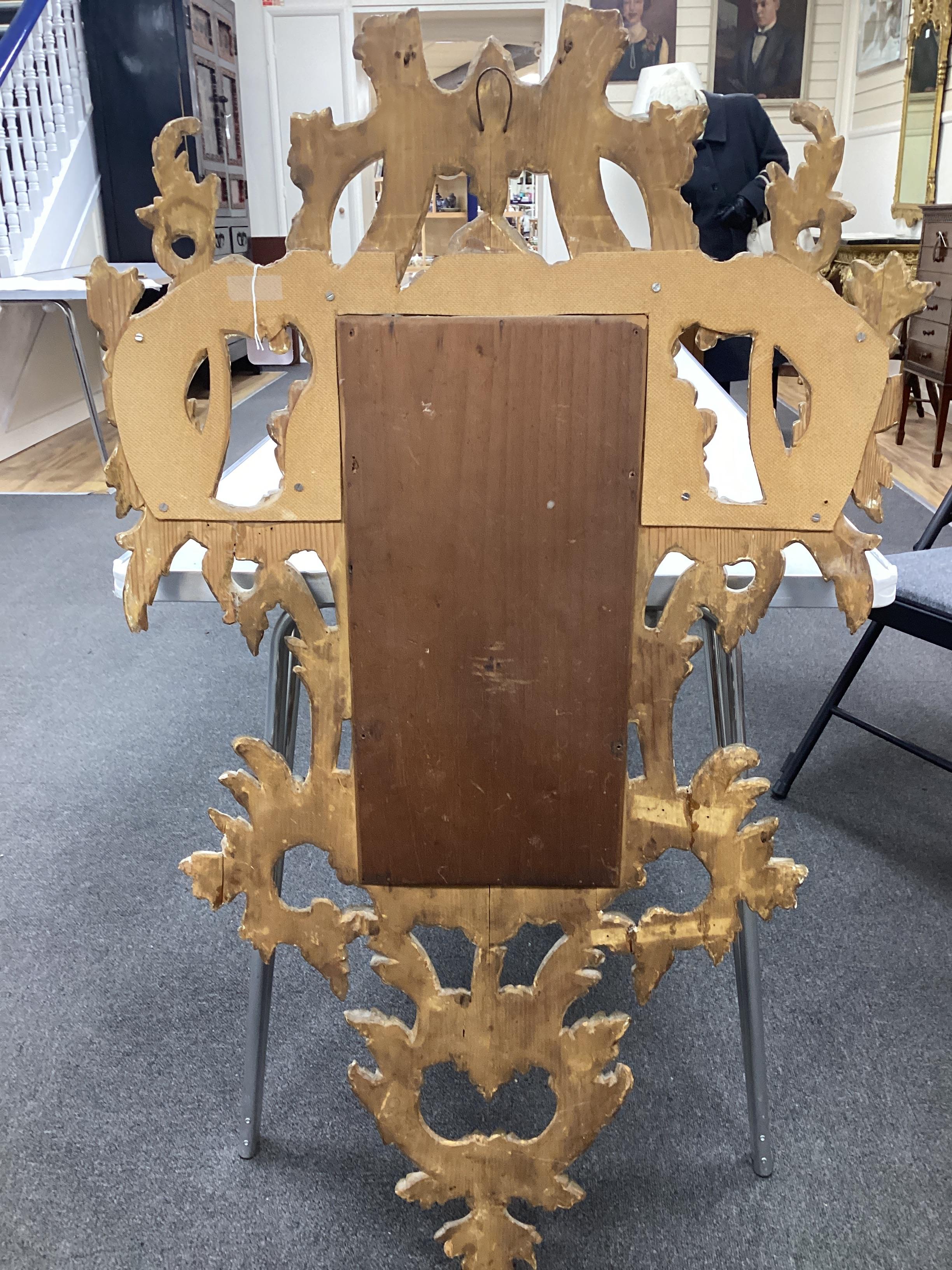 A pair of 18th century style carved giltwood wall mirrors, width 64cm, height 114cm